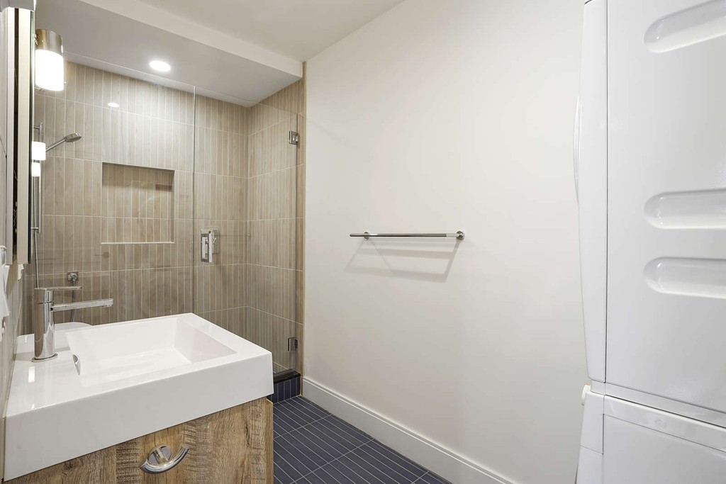 72 Beacon Street, Unit A Boston, MA 02108 - Photo 13 of 19 a bathroom with a sink a toilet a shower and a mirror