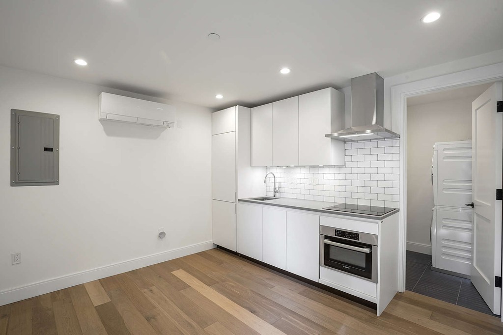 72 Beacon Street, Unit A Boston, MA 02108 - Photo 2 of 19 a kitchen with stainless steel appliances granite countertop a stove and a refrigerator