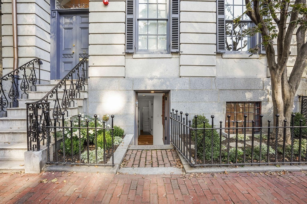 72 Beacon Street, Unit A Boston, MA 02108 - Photo 5 of 19 front view of a house with a garden