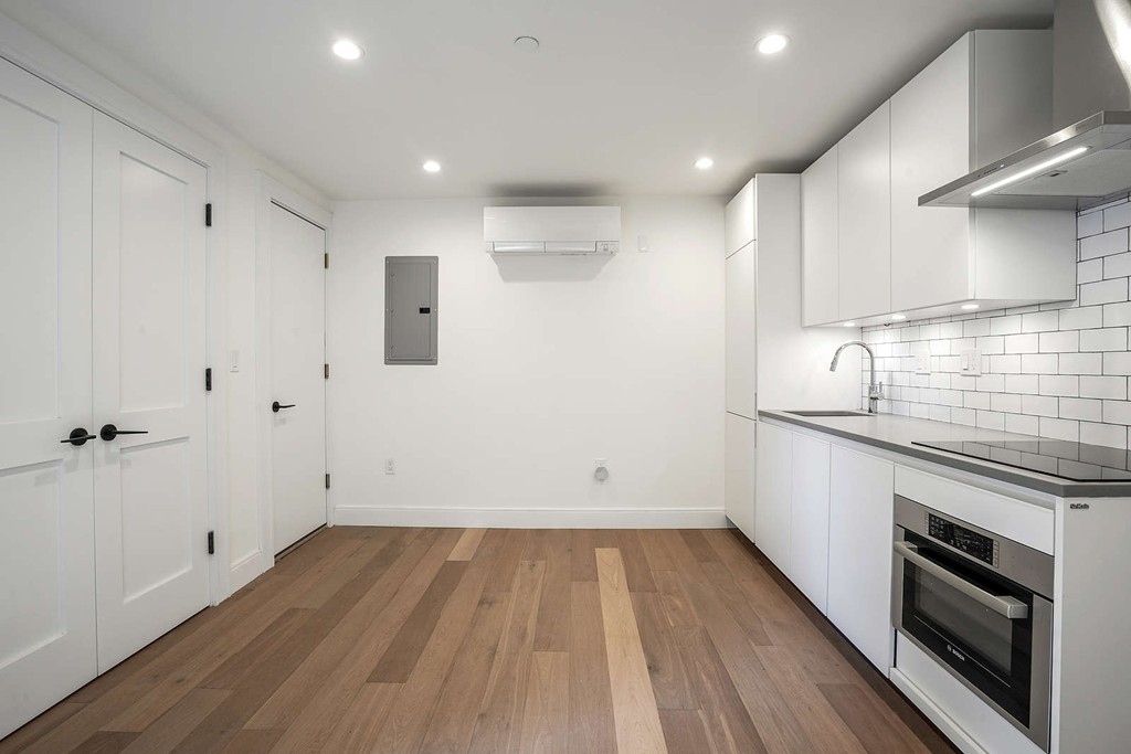 72 Beacon Street, Unit A Boston, MA 02108 - Photo 8 of 19 a kitchen with wooden floor and a sink