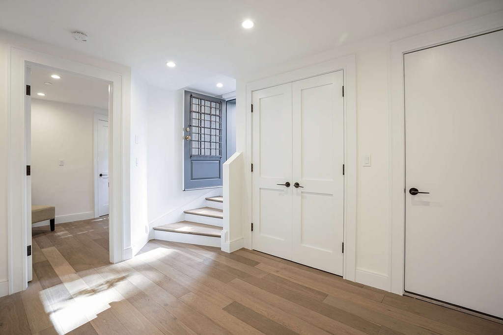 72 Beacon Street, Unit A Boston, MA 02108 - Photo 10 of 19 a view of a hallway with wooden floor and cabinet