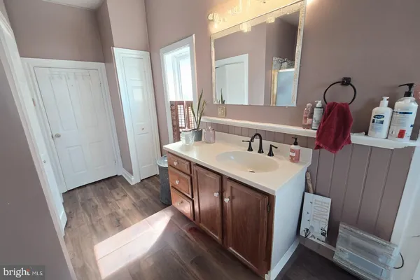 a bathroom with a sink and a mirror