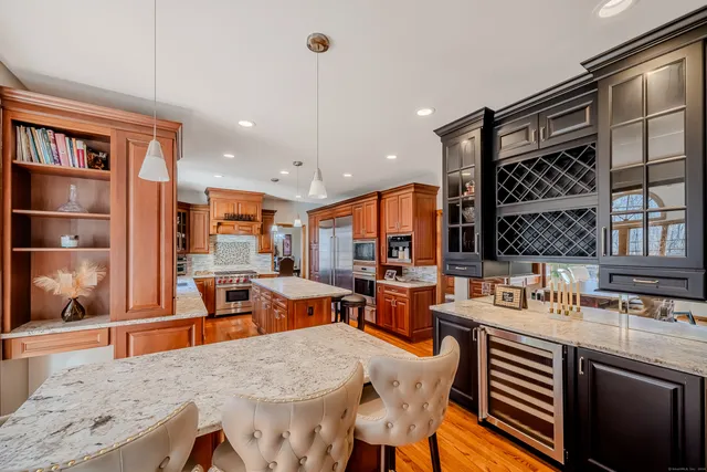 a large kitchen with a table and chairs