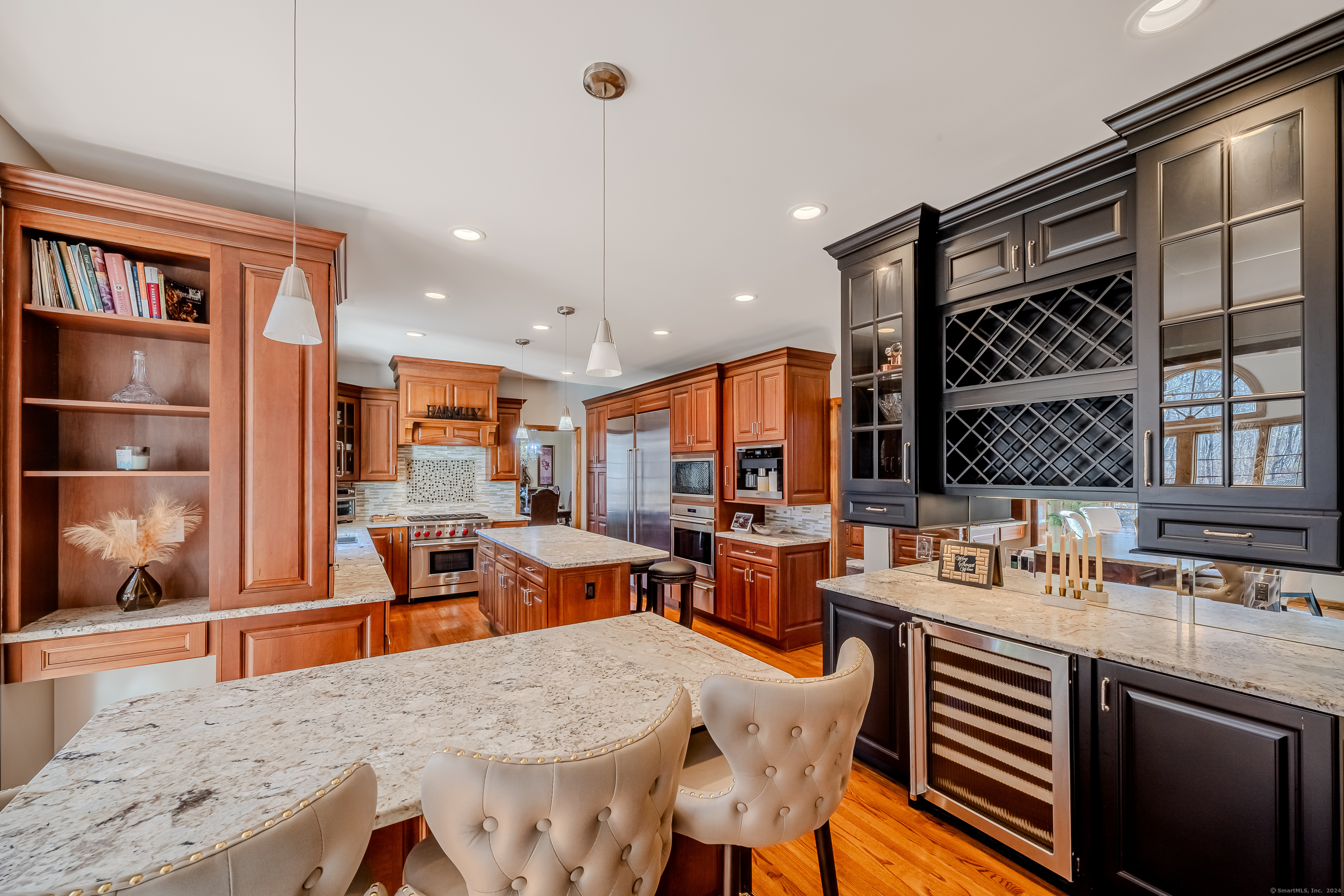 723 Laurie Lane Orange, CT 06477 - Photo 12 of 39 a large kitchen with a table and chairs