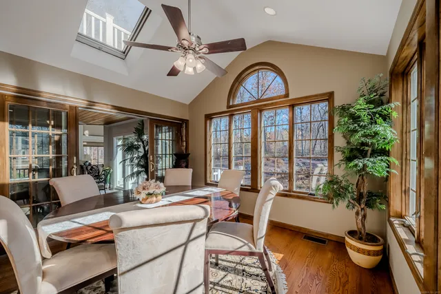 a dining room with furniture garden view and a potted plant