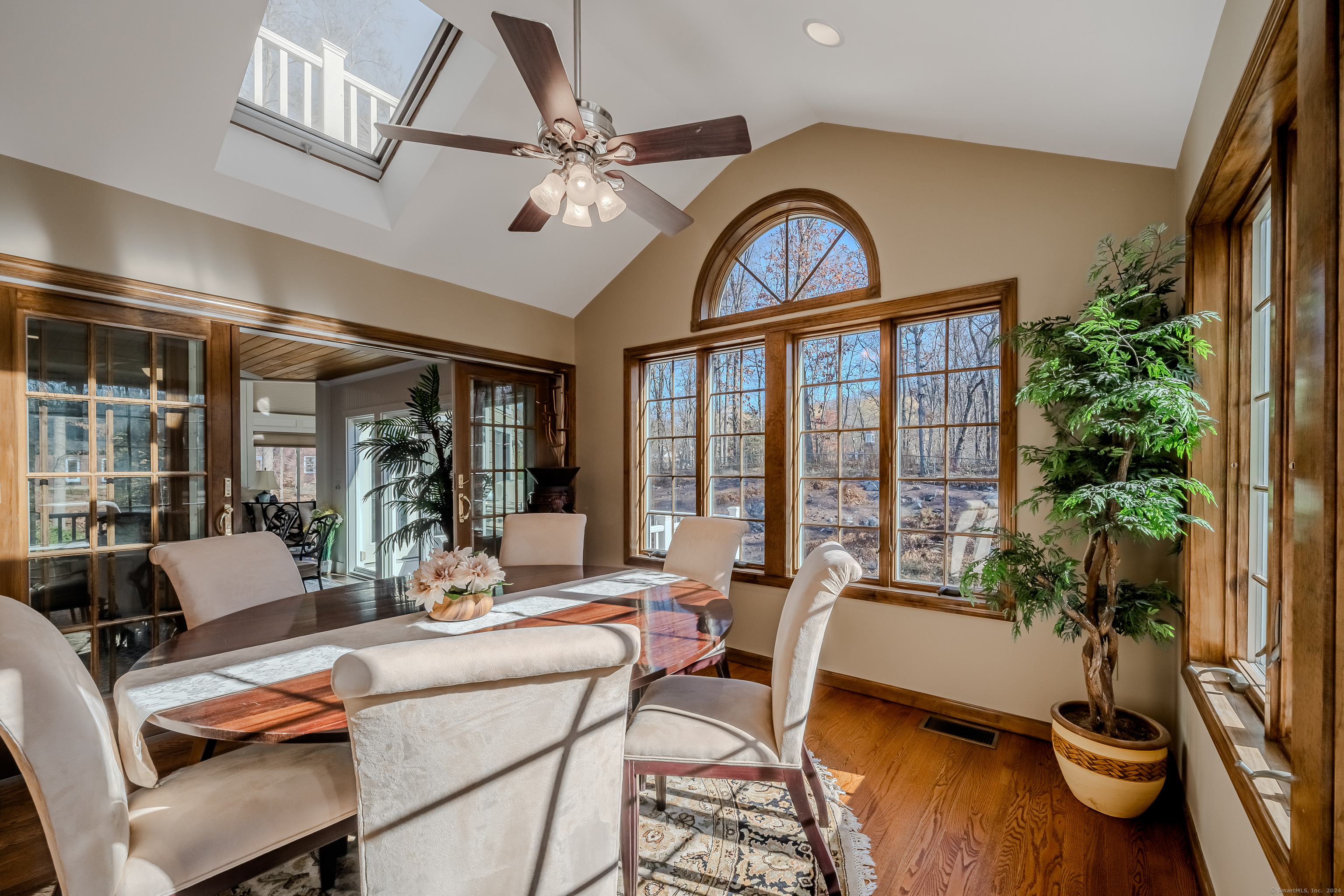 723 Laurie Lane Orange, CT 06477 - Photo 16 of 39 a dining room with furniture garden view and a potted plant
