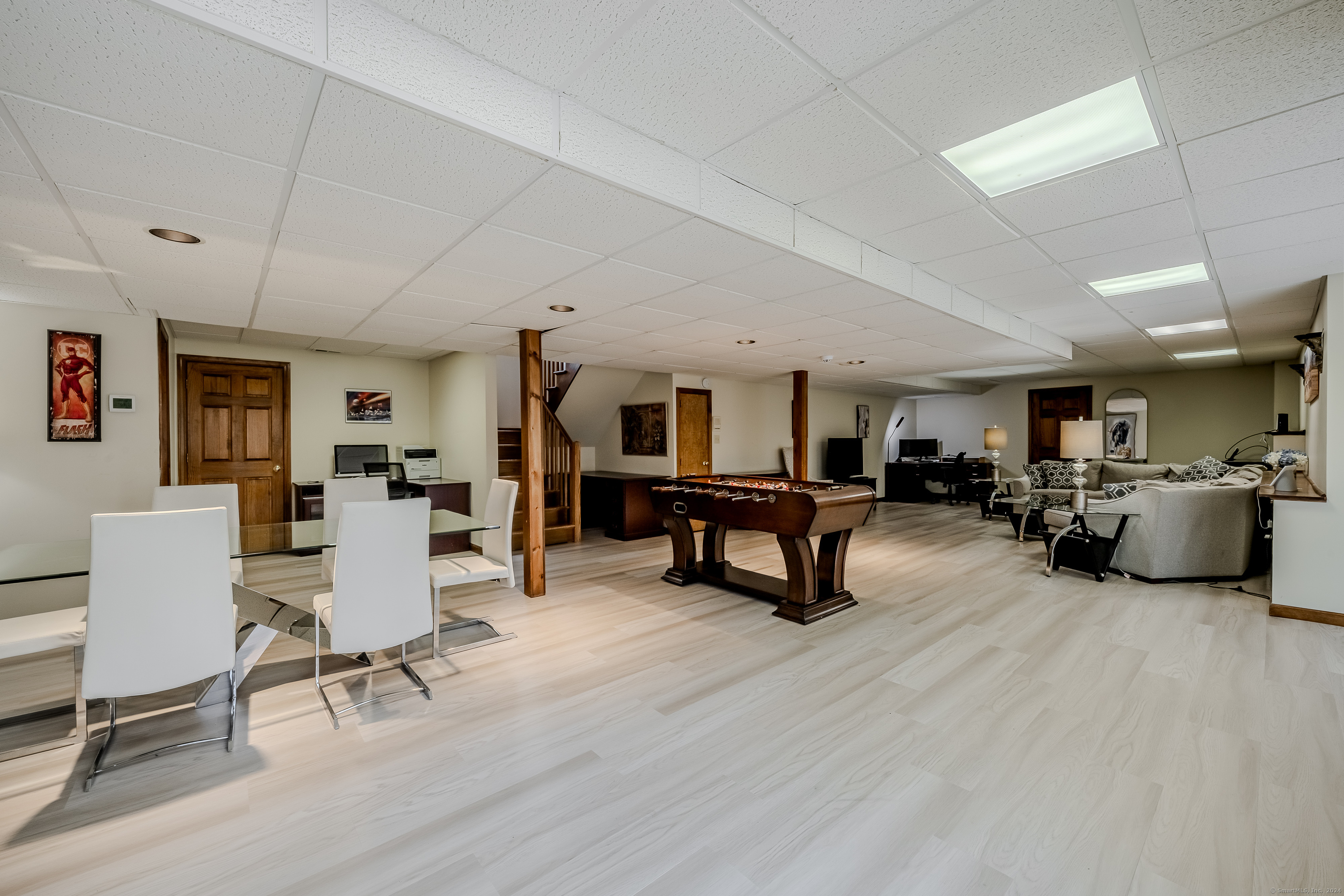723 Laurie Lane Orange, CT 06477 - Photo 32 of 39 a living room with furniture and a wooden floor