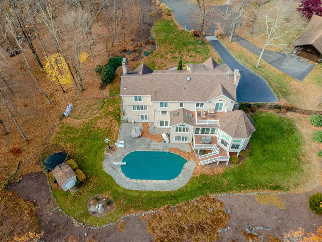 an aerial view of a house with swimming pool