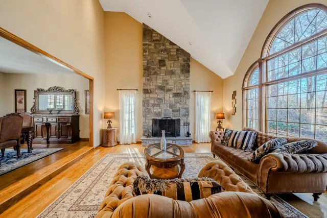 a living room with furniture fireplace and a fireplace