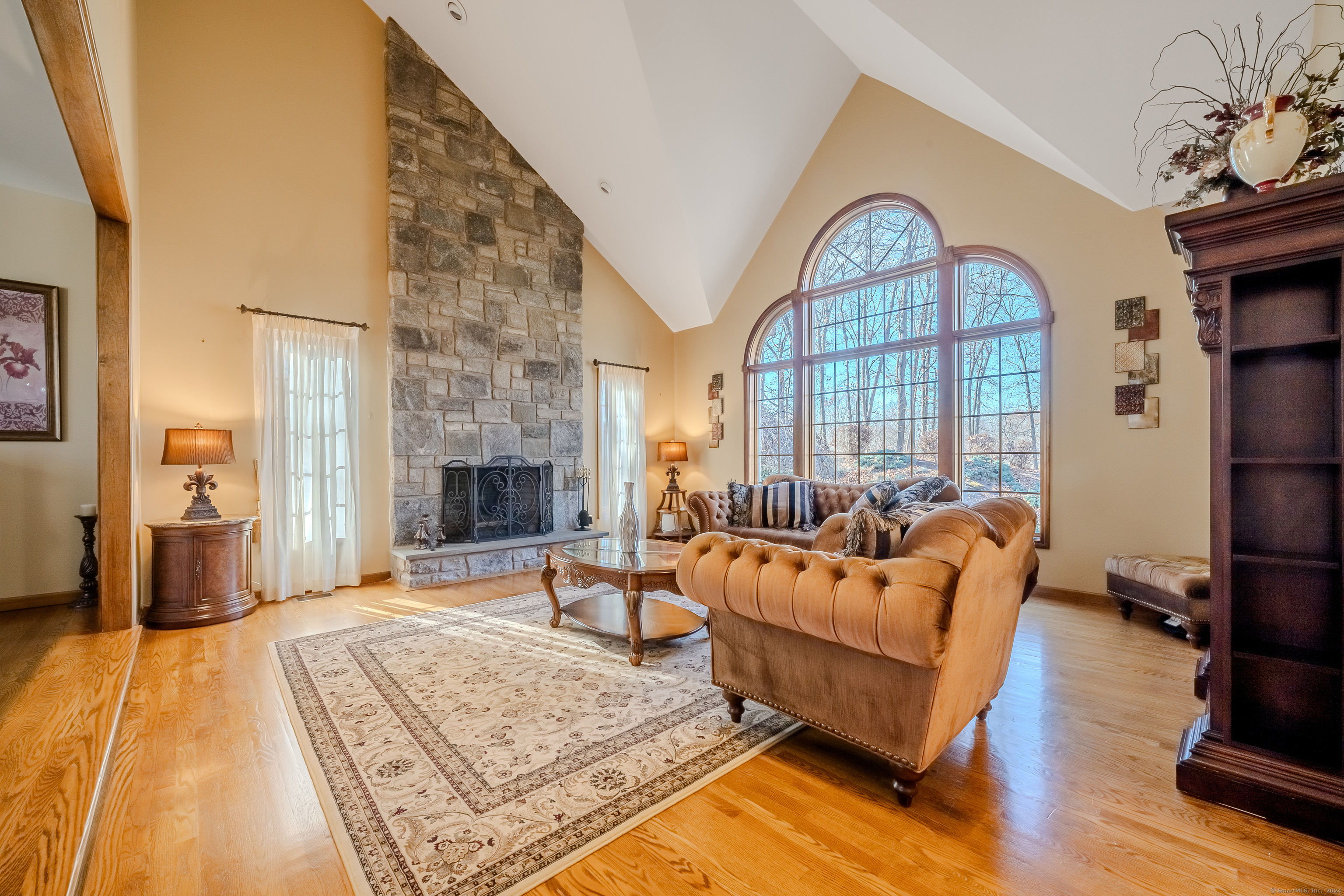 723 Laurie Lane Orange, CT 06477 - Photo 6 of 39 a living room with furniture fireplace and wooden floor