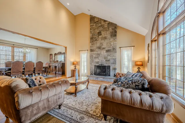 a living room with furniture fireplace and a fireplace