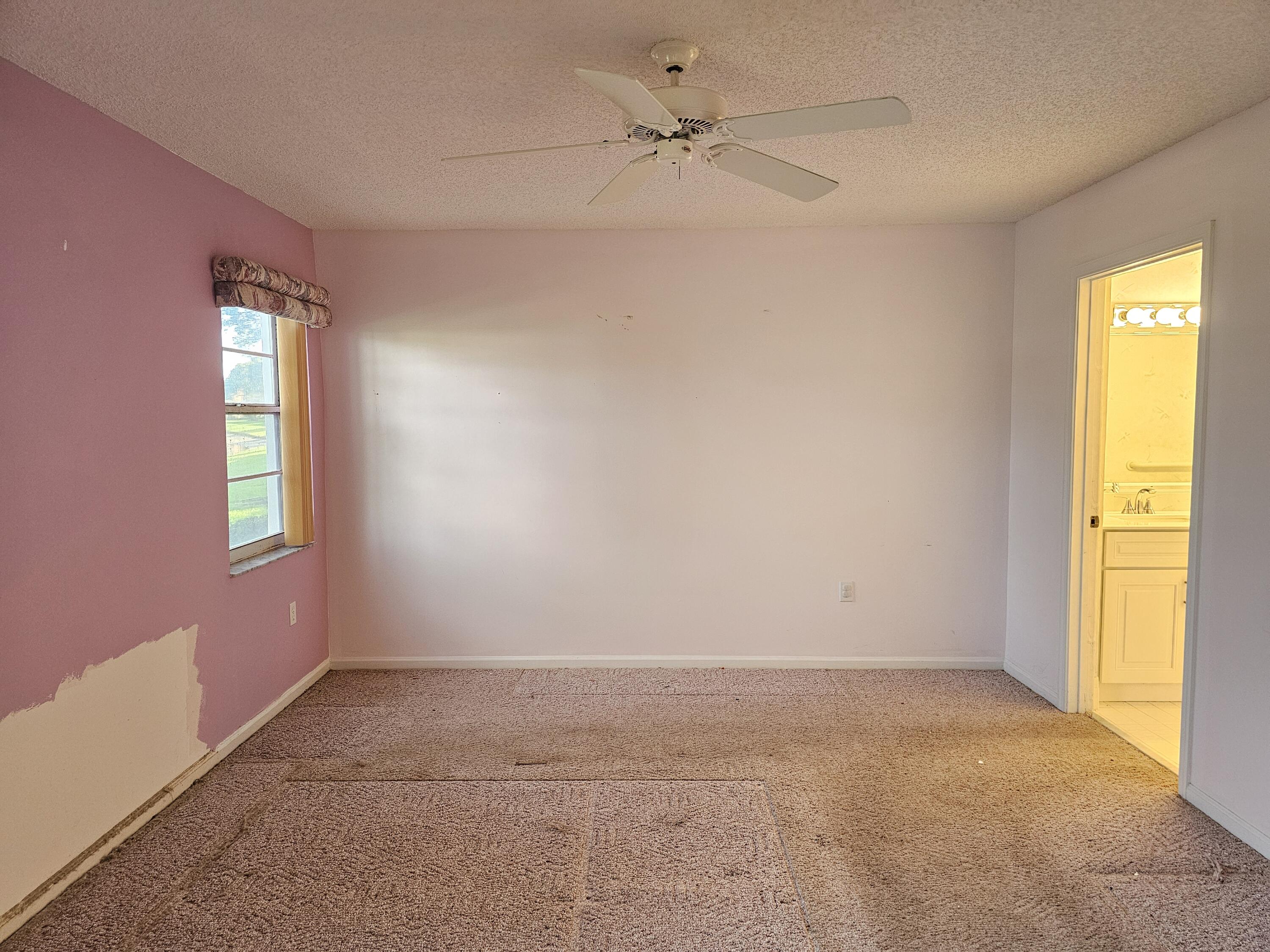 9963 Seacrest Circle, Unit 101 Boynton Beach, FL 33437 - Photo 16 of 27 a view of an empty room with a window