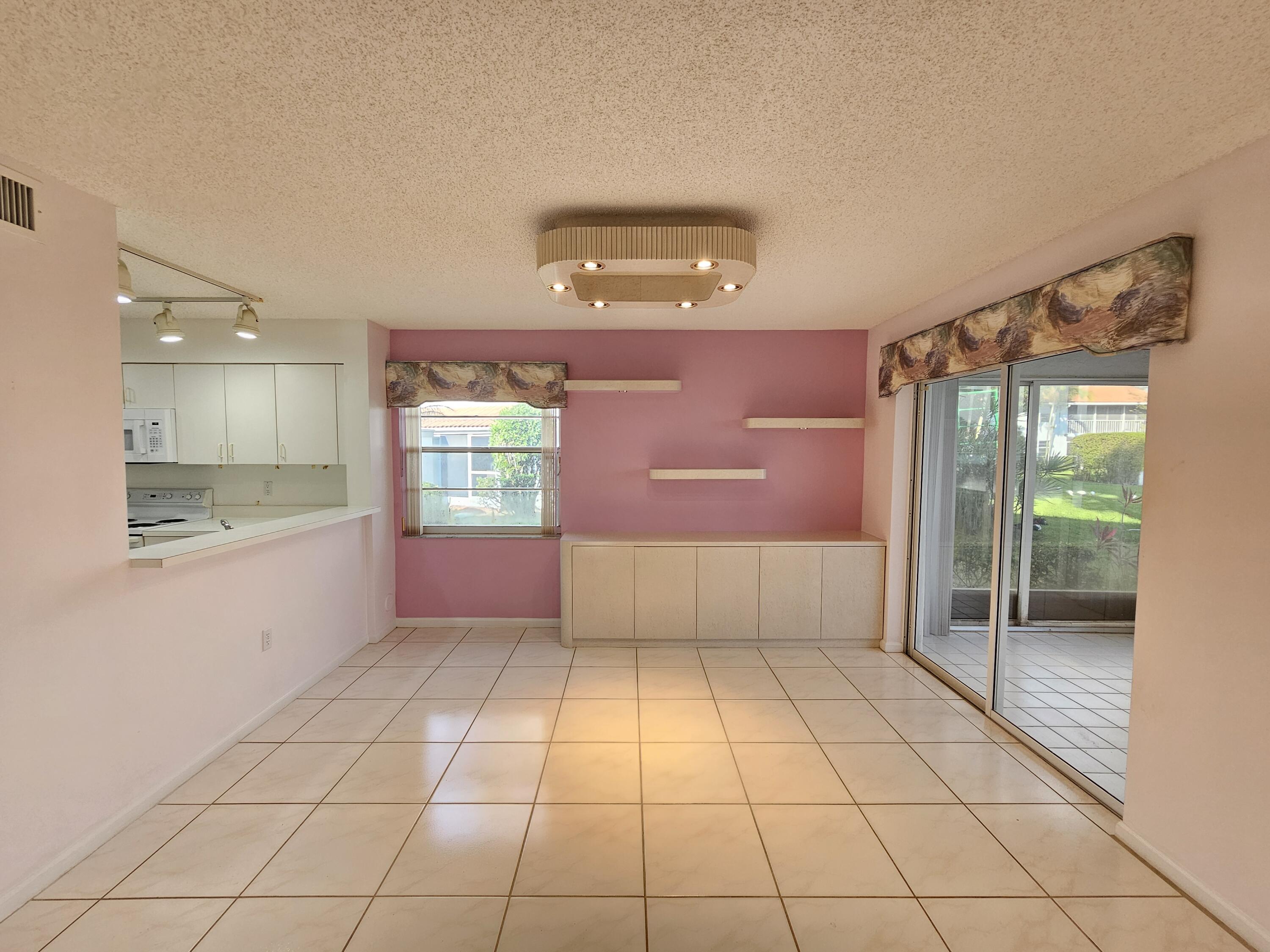 9963 Seacrest Circle, Unit 101 Boynton Beach, FL 33437 - Photo 9 of 27 a view of an empty room and window