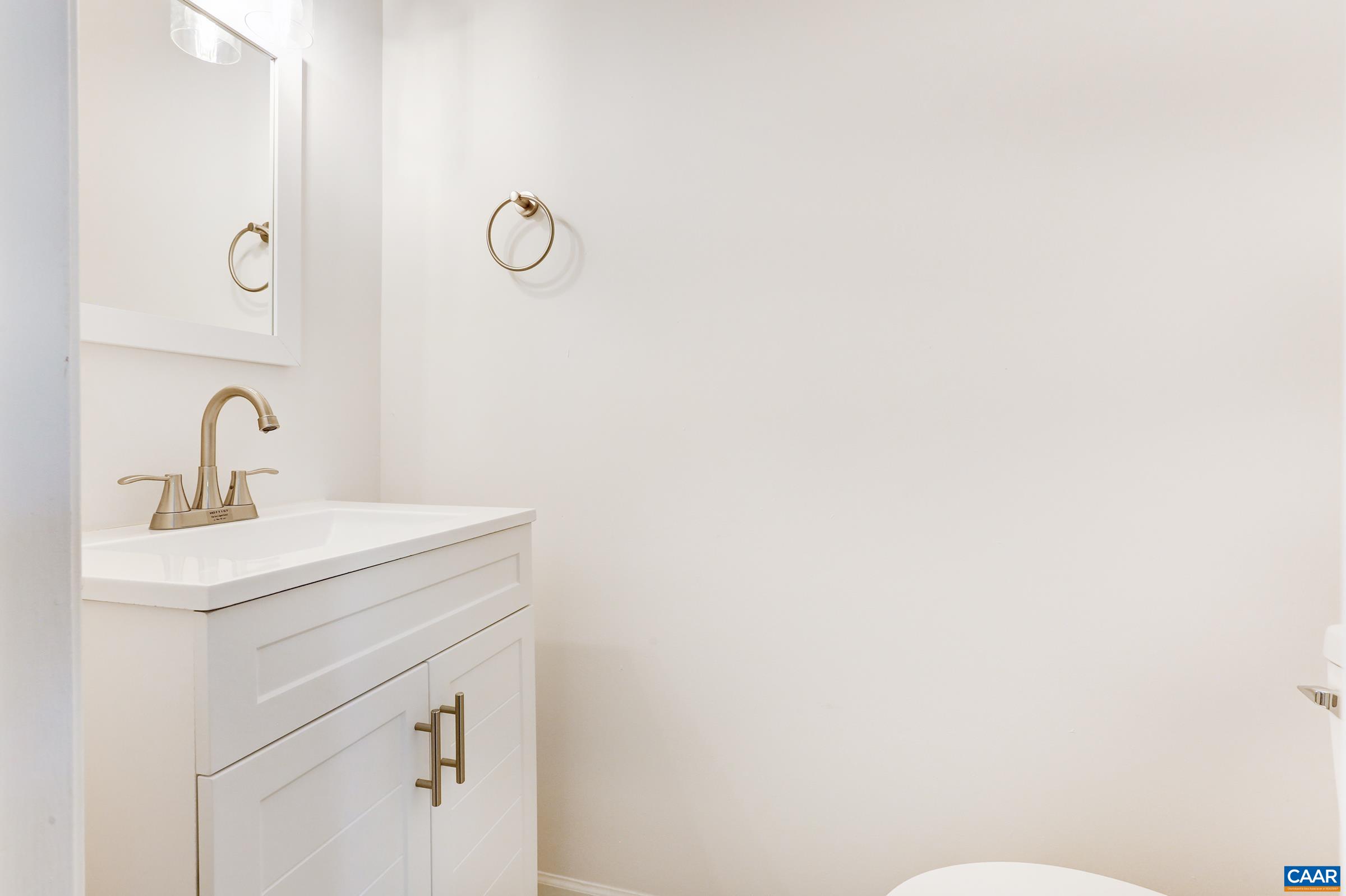 605 Bailey Road Charlottesville, VA 22903 - Photo 12 of 25 a bathroom with a sink a toilet and mirror