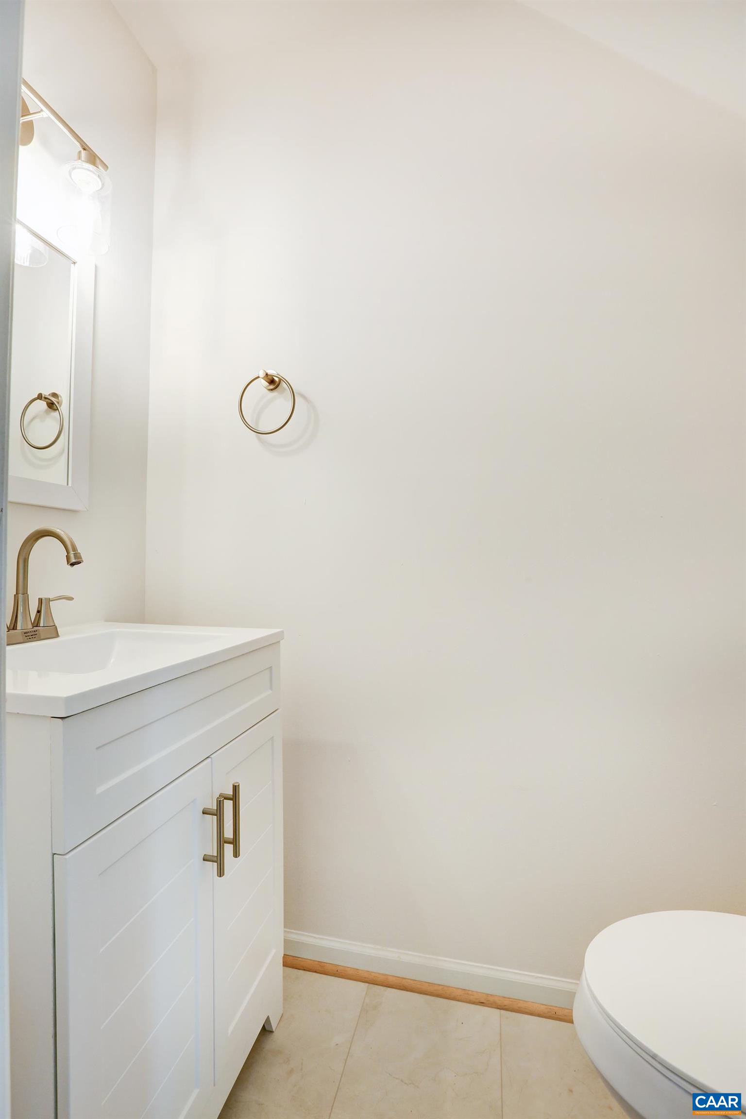 605 Bailey Road Charlottesville, VA 22903 - Photo 13 of 25 a bathroom with a sink a toilet and a mirror