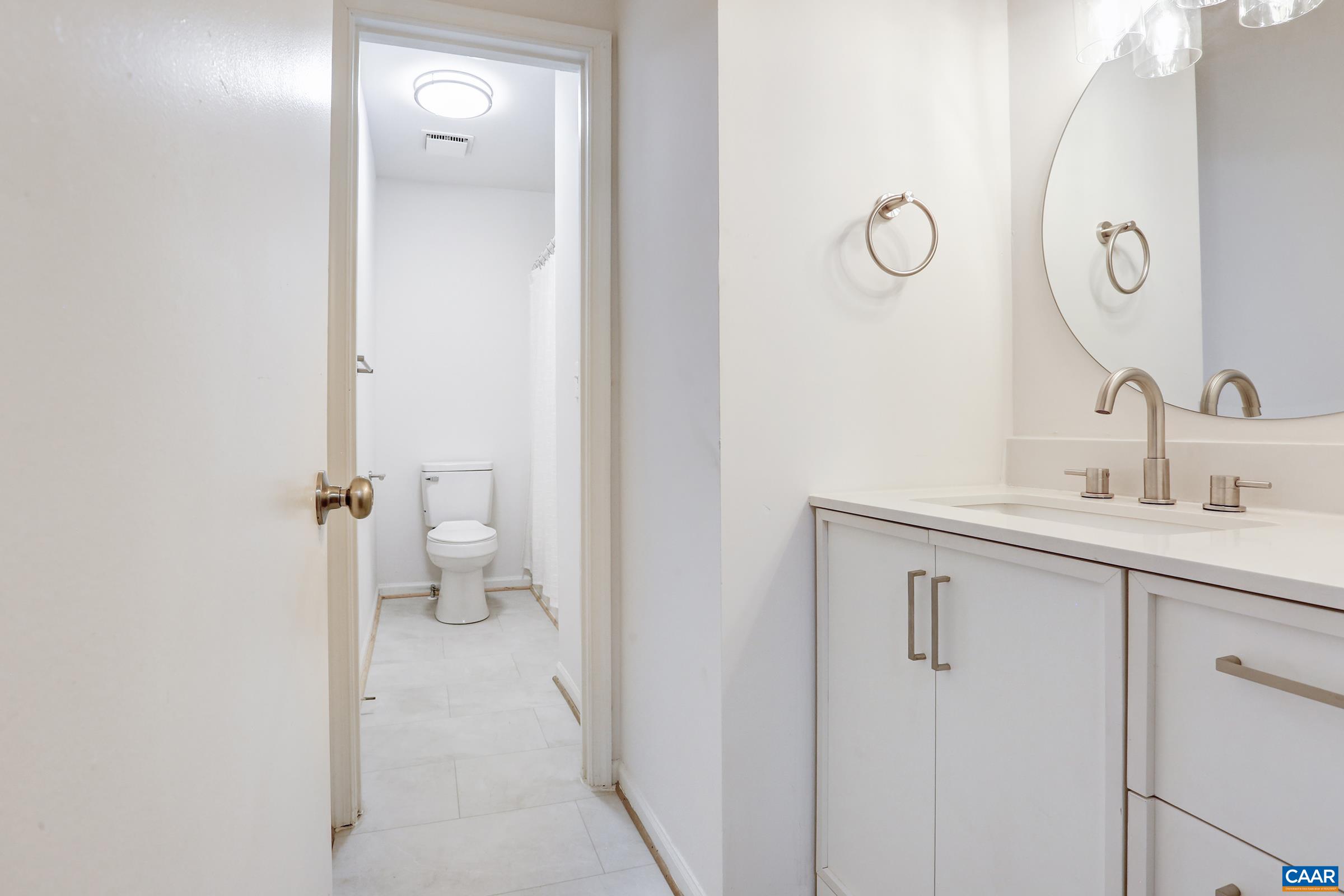 605 Bailey Road Charlottesville, VA 22903 - Photo 16 of 25 a bathroom with a sink and a mirror