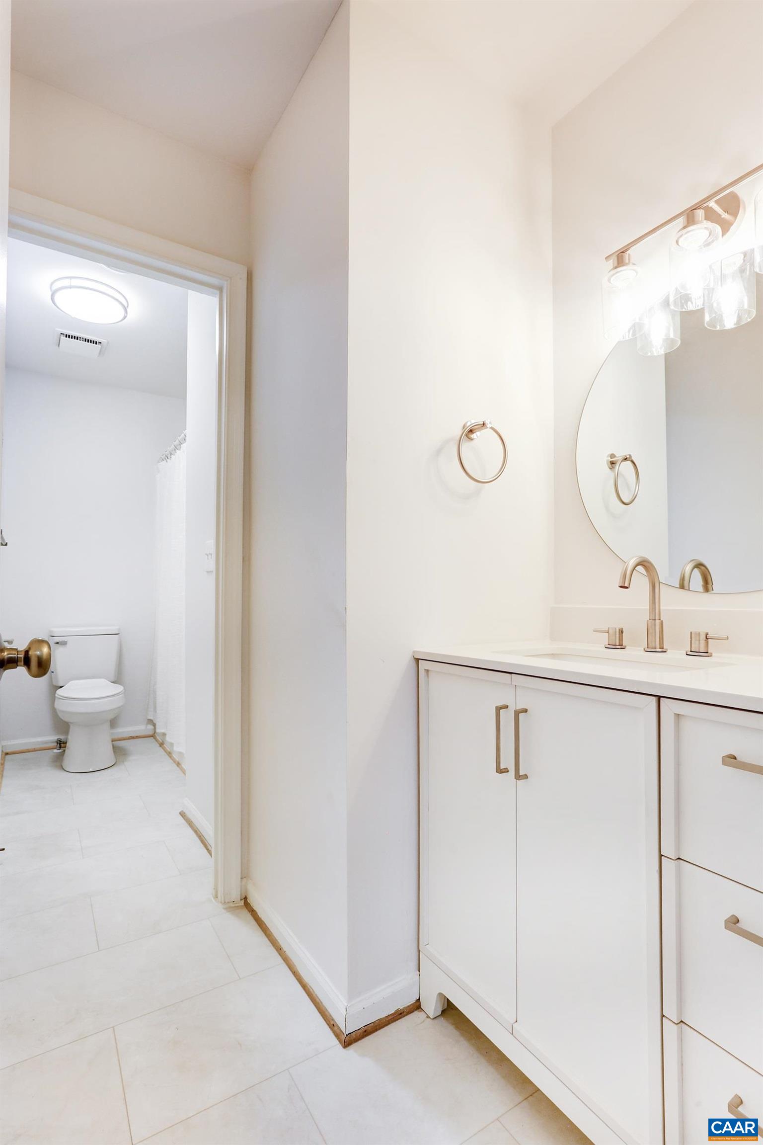 605 Bailey Road Charlottesville, VA 22903 - Photo 17 of 25 a en suite bathroom with a sink and a mirror