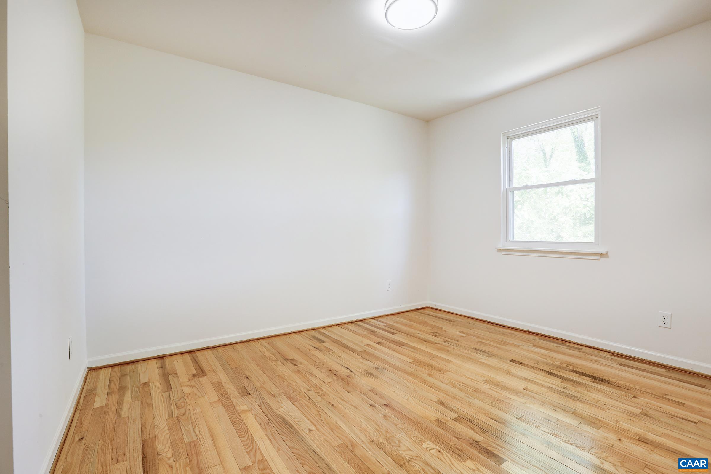 605 Bailey Road Charlottesville, VA 22903 - Photo 21 of 25 an empty room with a window