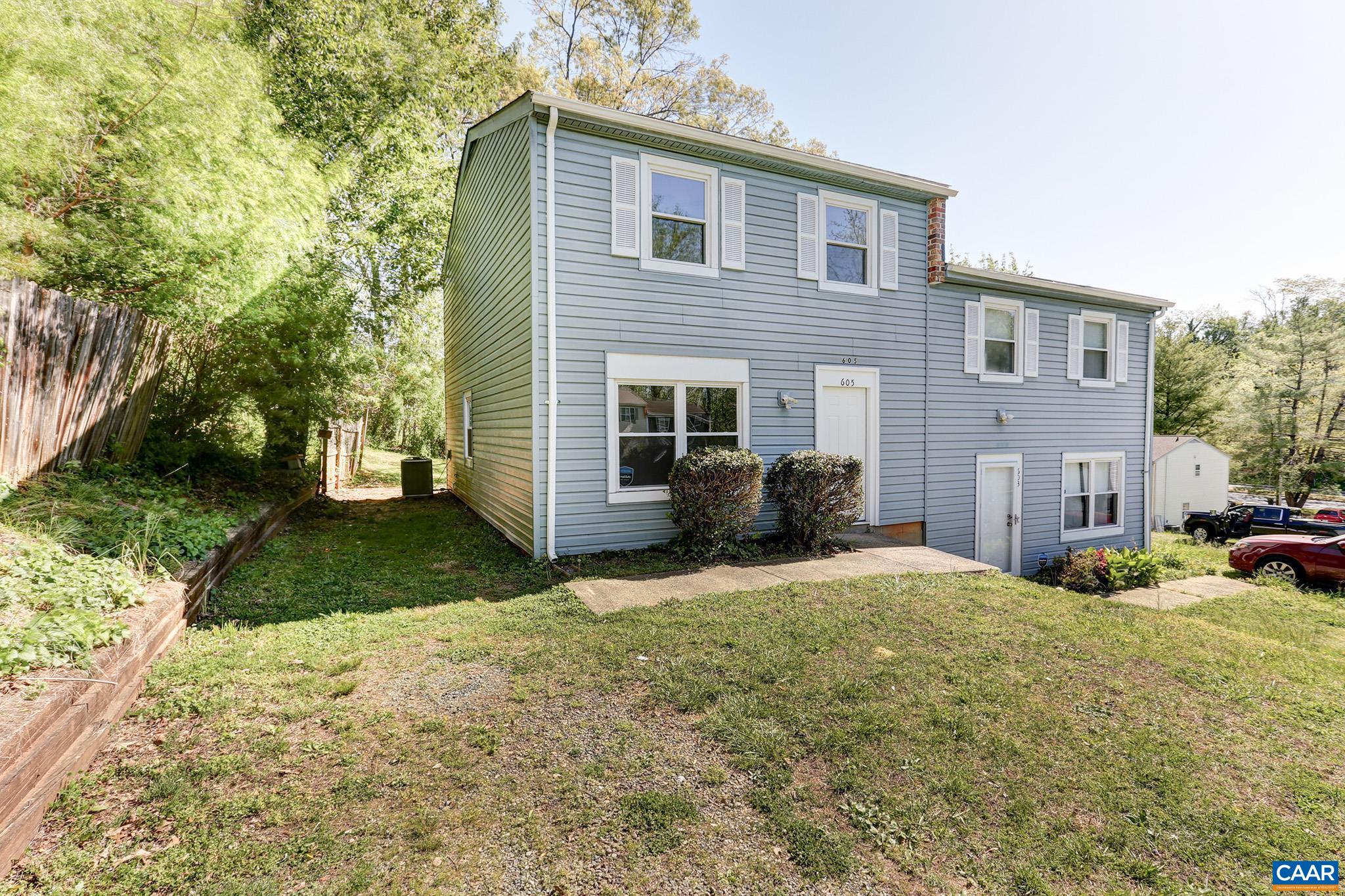 605 Bailey Road Charlottesville, VA 22903 - Photo 3 of 25 a front view of a house with a yard and garage