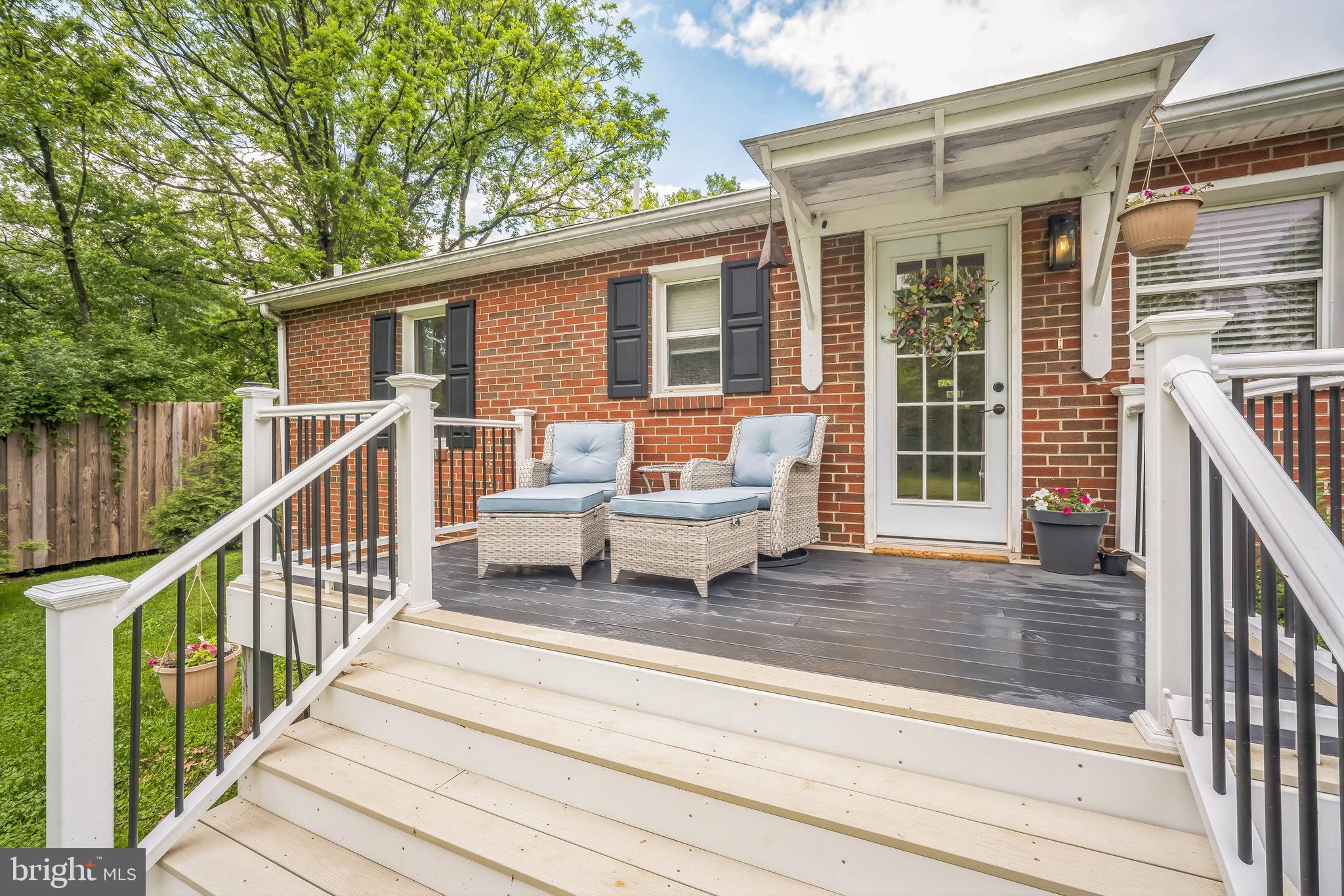 6637A Mt Phillip Road Frederick, MD 21703 - Photo 7 of 29 a balcony with wooden floor and outdoor seating