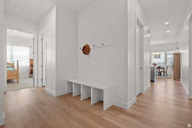 531 North Legend Way West, Unit D Mapleton, UT 84664 - Photo 24 of 42 Hall with healthy amount of natural light, recessed lighting, and light wood finished floors