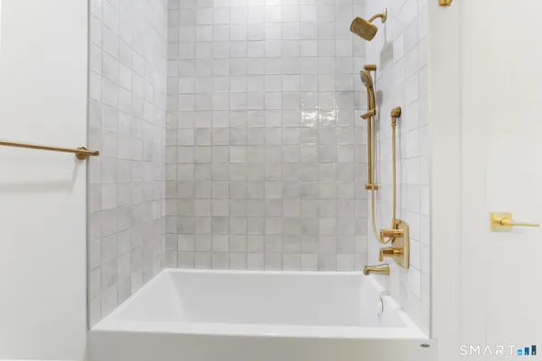 a close up of a bathtub in bathroom