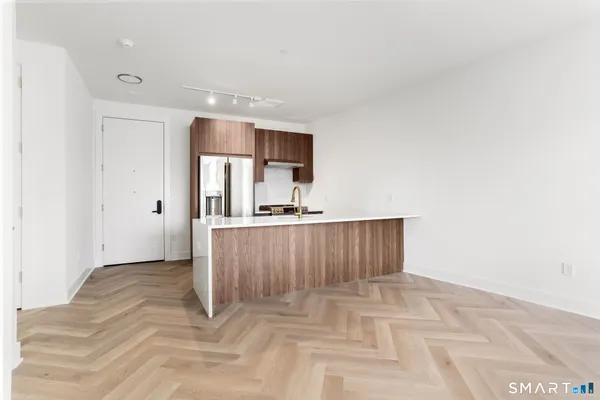 a view of kitchen with cabinets