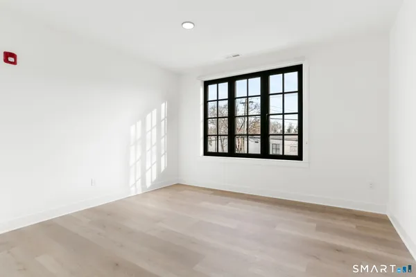 a view of an empty room with a window