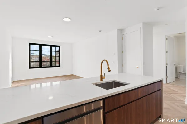 a kitchen with a sink and a window