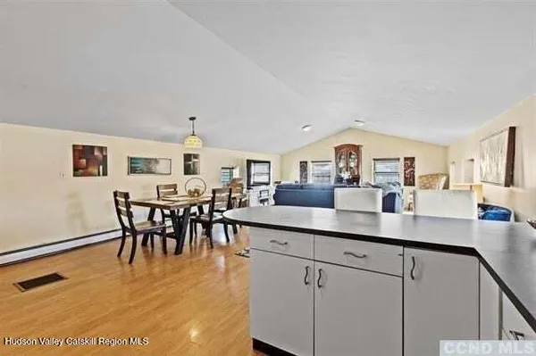 a view of a kitchen and dining room
