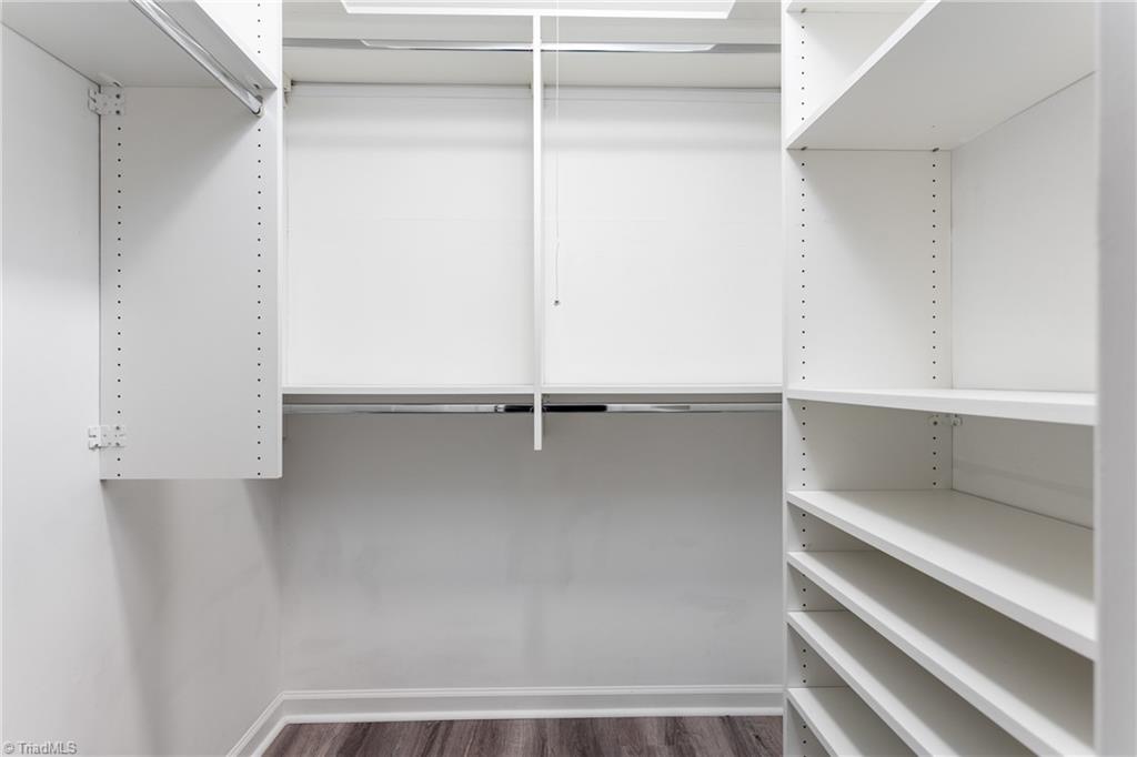 4849 Tower Road, Unit F Greensboro, NC 27410 - Photo 14 of 24 Primary BR features a walk-in closet with closet organzer
