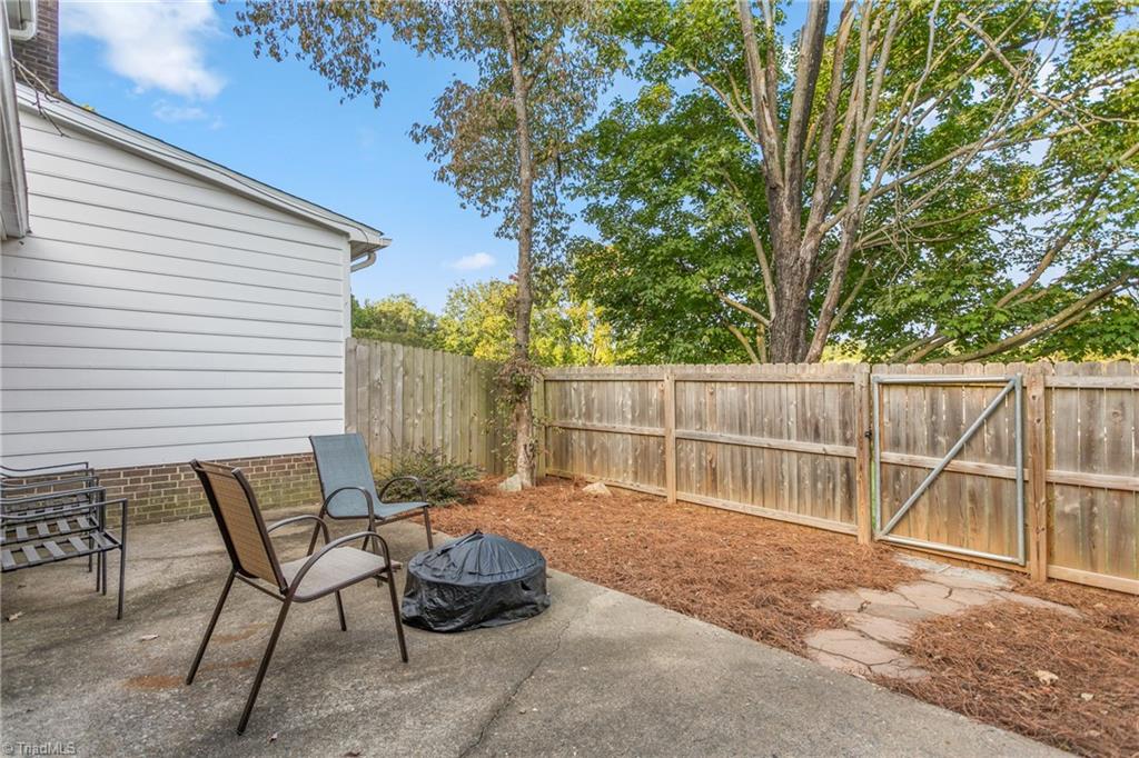 4849 Tower Road, Unit F Greensboro, NC 27410 - Photo 20 of 24 Spacious patio with privacy fence