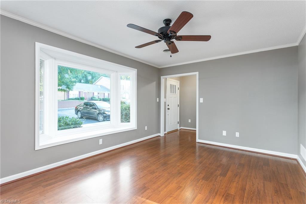 4849 Tower Road, Unit F Greensboro, NC 27410 - Photo 3 of 24 Living Room bay window allows abundant natural lighting
