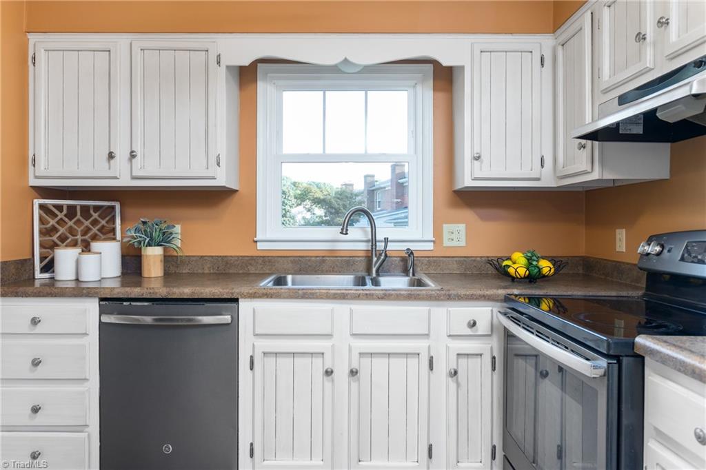 4849 Tower Road, Unit F Greensboro, NC 27410 - Photo 7 of 24 Open kitchen with good counter/workspace.