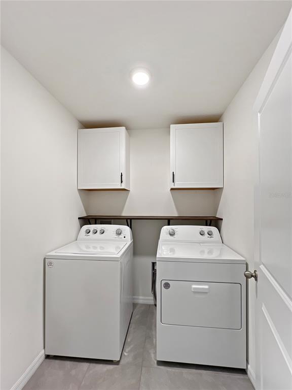 5563 Southwest 43rd Court Ocala, FL 34474 - Photo 37 of 51 a utility room with dryer and washer