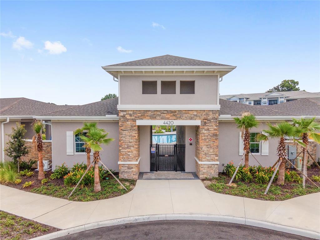 5563 Southwest 43rd Court Ocala, FL 34474 - Photo 42 of 51 a view of a house with potted plants