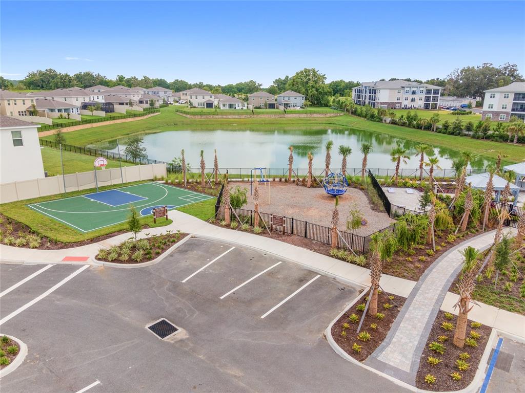 5563 Southwest 43rd Court Ocala, FL 34474 - Photo 43 of 51 a view of a lake with a table and chairs