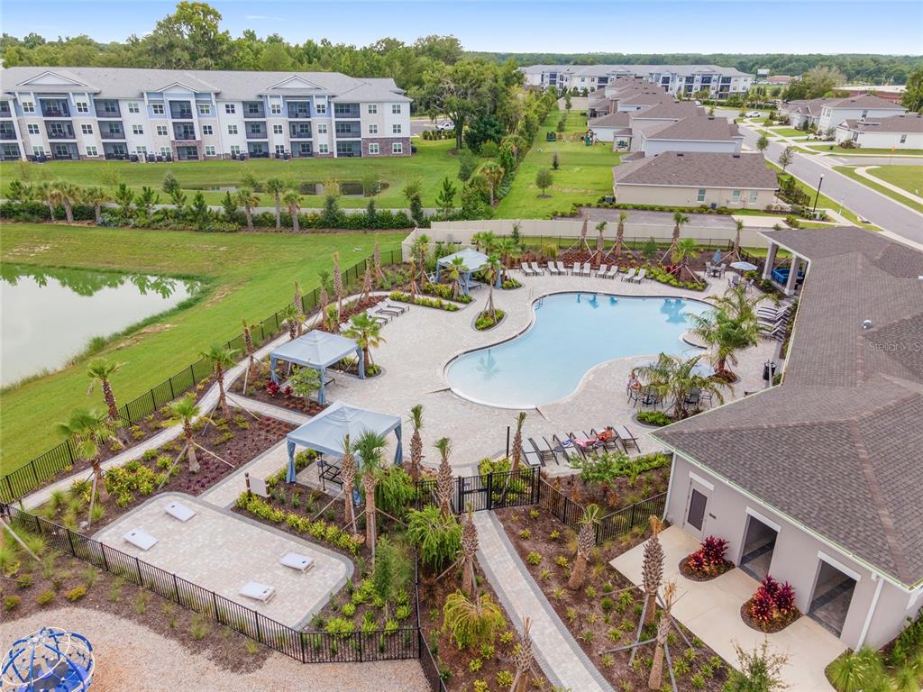 5563 Southwest 43rd Court Ocala, FL 34474 - Photo 45 of 51 an aerial view of a house with a garden and lake view