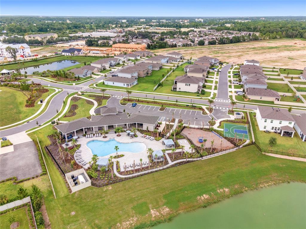5563 Southwest 43rd Court Ocala, FL 34474 - Photo 48 of 51 an aerial view of a swimming pool with outdoor seating yard and ocean view