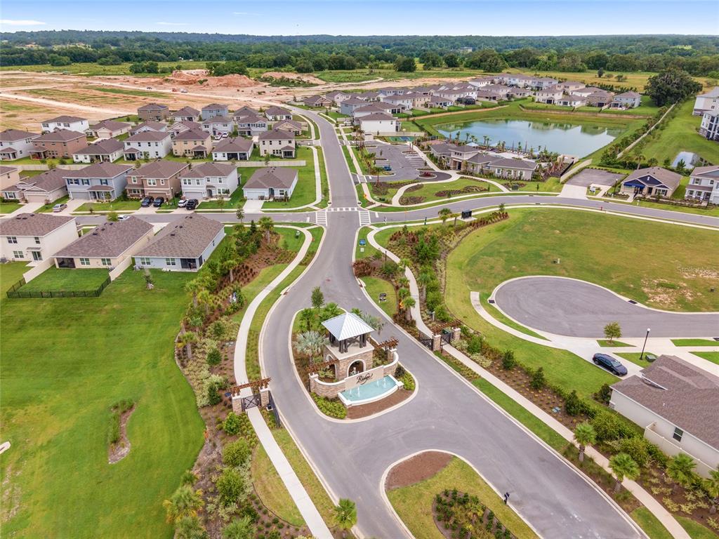5563 Southwest 43rd Court Ocala, FL 34474 - Photo 51 of 51 an aerial view of a swimming pool with a lake view