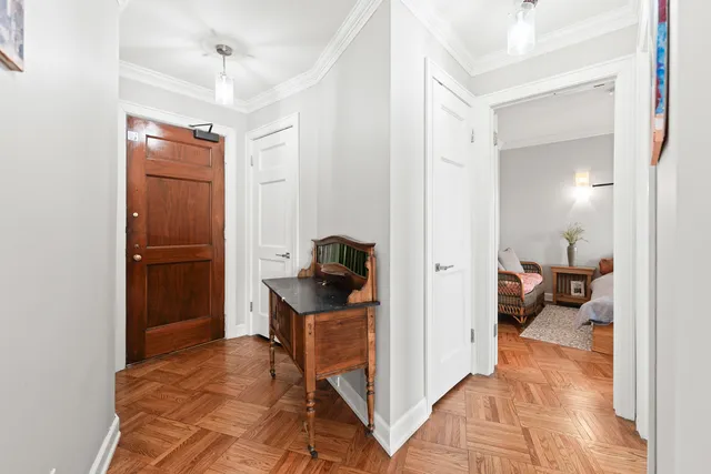 a view of a hallway and a livingroom with couch