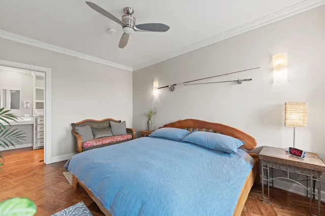 a bedroom with a bed and a table