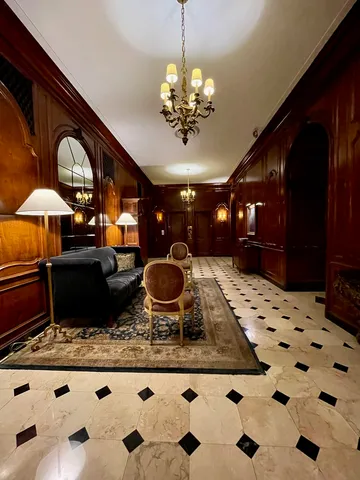 a kitchen with a stove a refrigerator and a dining table