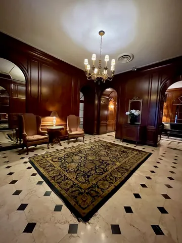 a large kitchen with stainless steel appliances granite countertop a sink stove and refrigerator