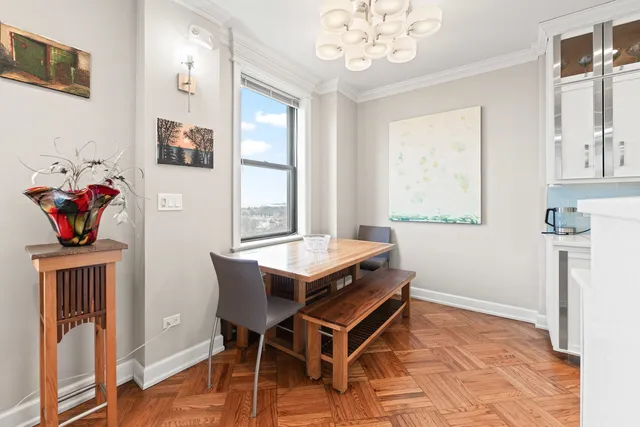 a view of a dining room with furniture window and wooden floor