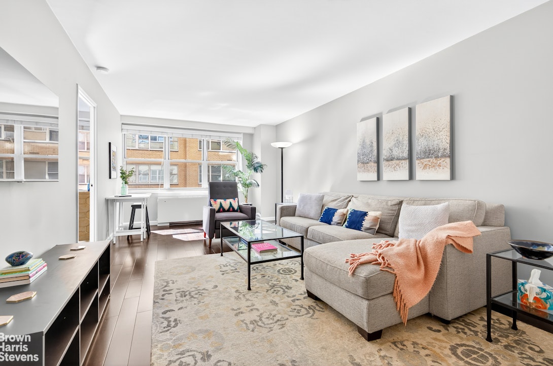 a living room with furniture and a window