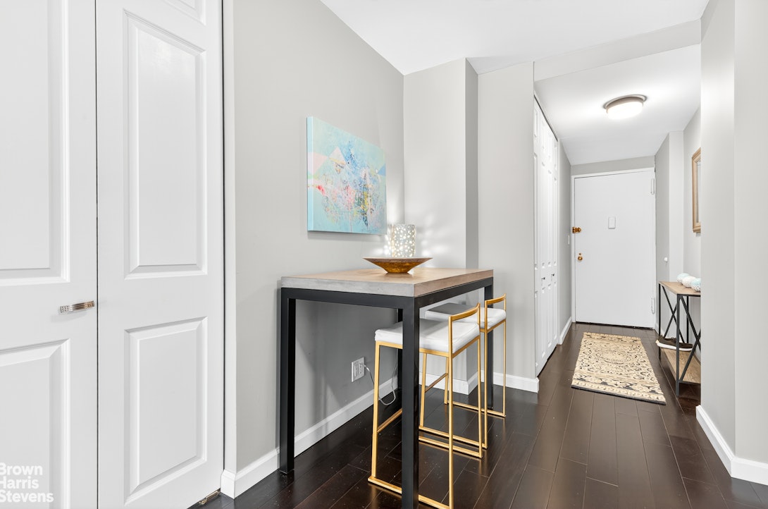520 East 72nd Street, Unit 5F Manhattan, NY 10021 - Photo 4 of 16 a view of hallway with furniture and wooden floor