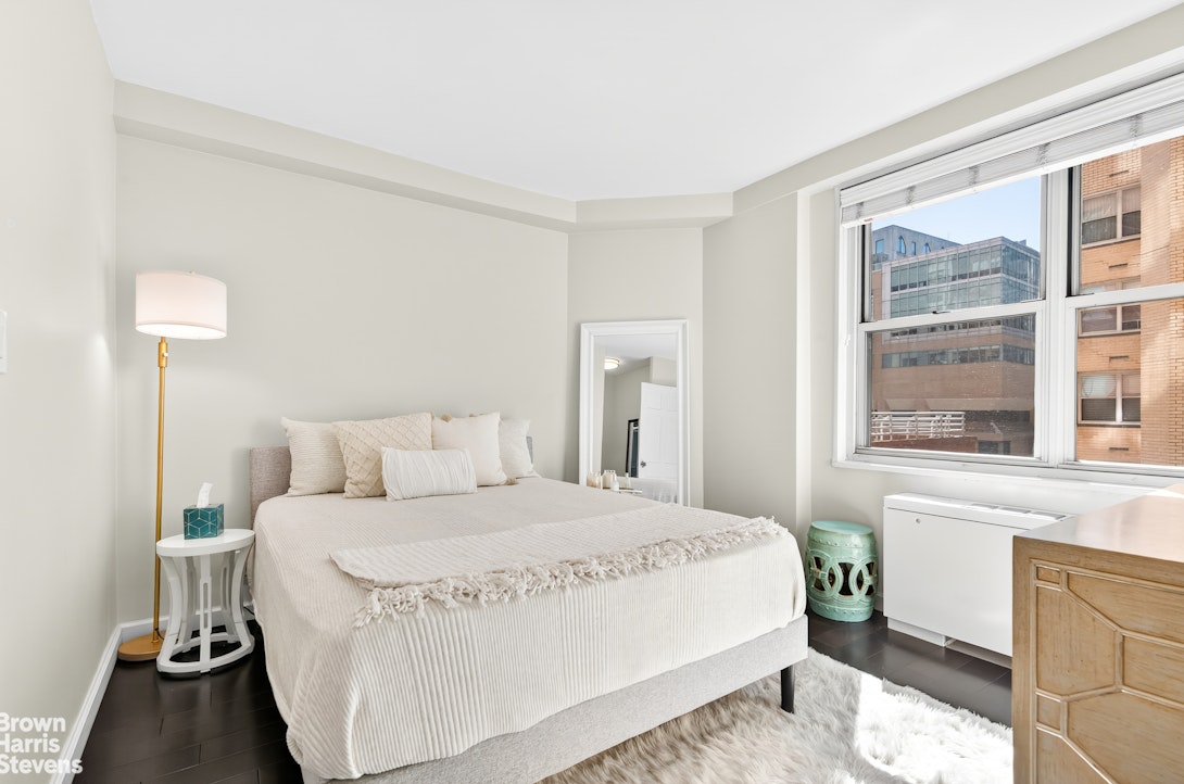 520 East 72nd Street, Unit 5F Manhattan, NY 10021 - Photo 6 of 16 a bedroom with a bed and a window