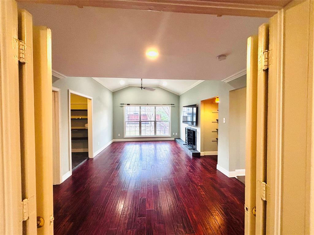 4902 West Mockingbird Lane Dallas, TX 75209 - Photo 2 of 7 a view of empty room with wooden floor and fan