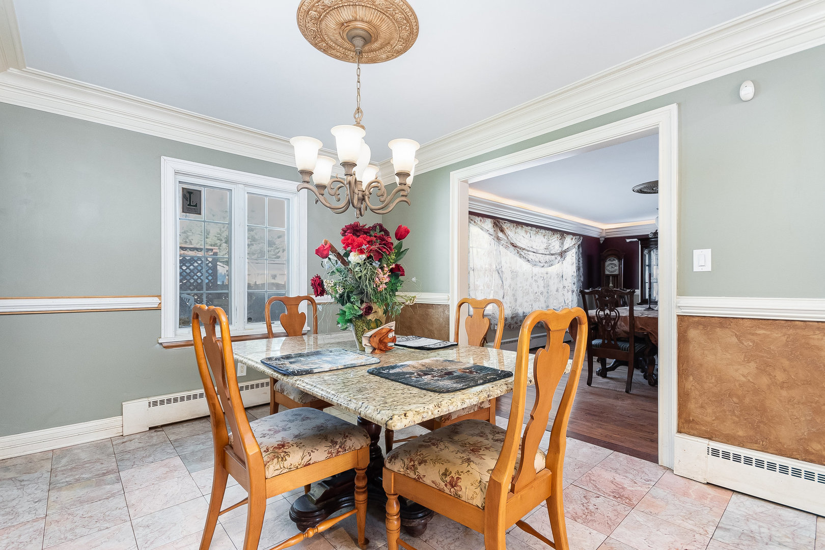 2207 Jericho Road Aurora, IL 60506 - Photo 5 of 18 a dining room with furniture a chandelier and window